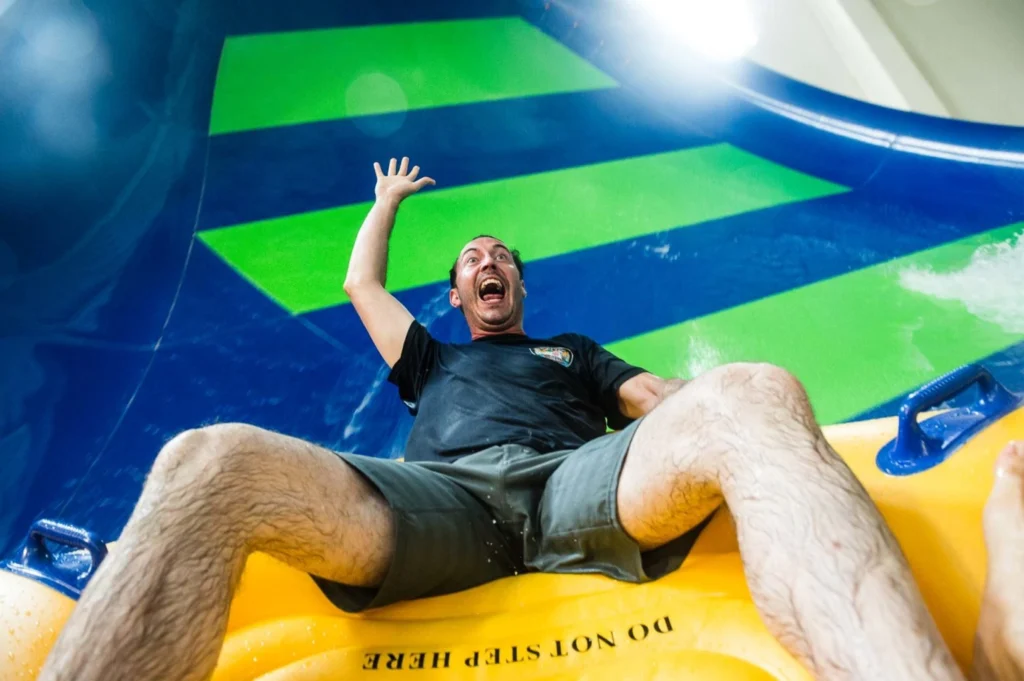 Johnny “posing” nearly weightless on a waterslide at Kalahari as I hung to my camera for dear life.