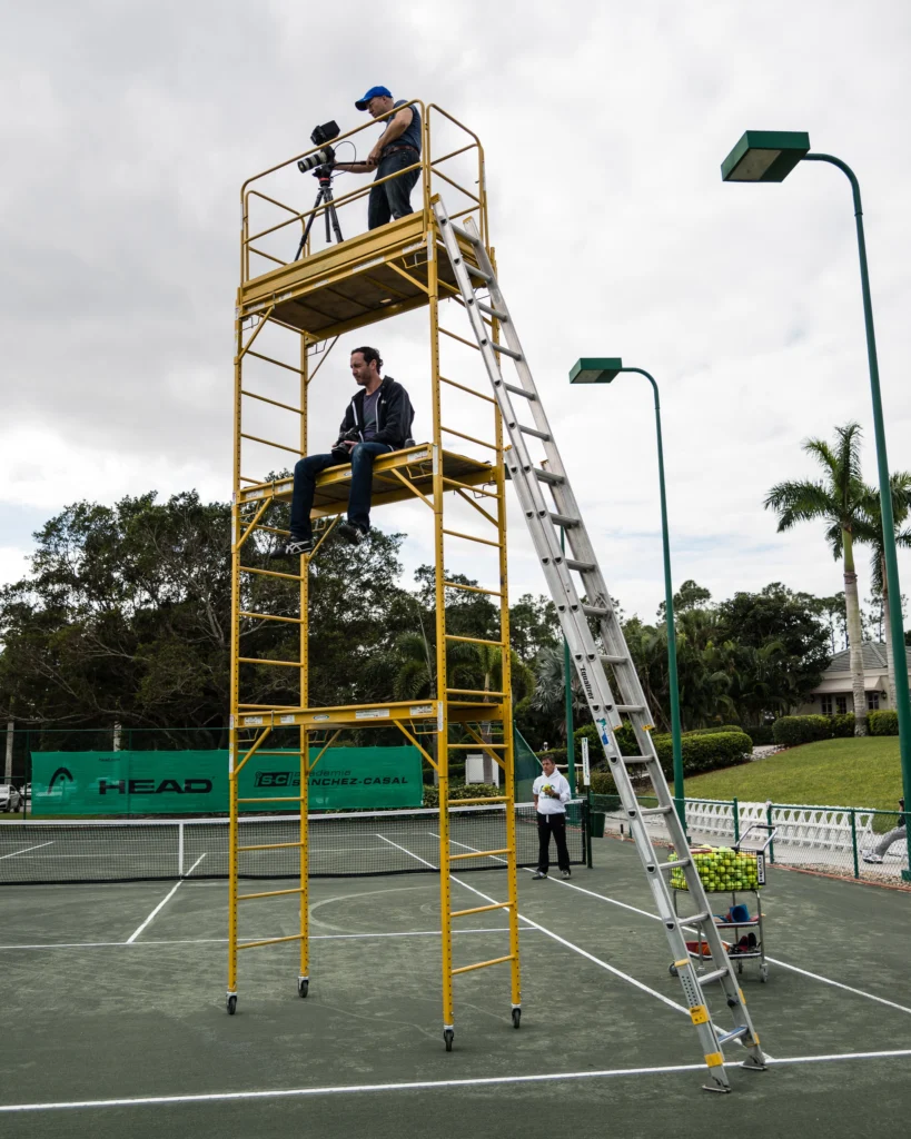 Johnny and I shooting at Sanchez-Casal Academy as Emilio stands a safe distance away!