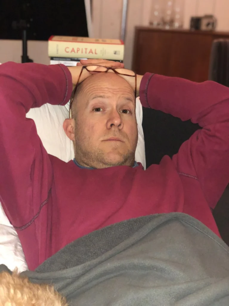 My typical pose during this time period. I never did start that damn book, much less finish it.