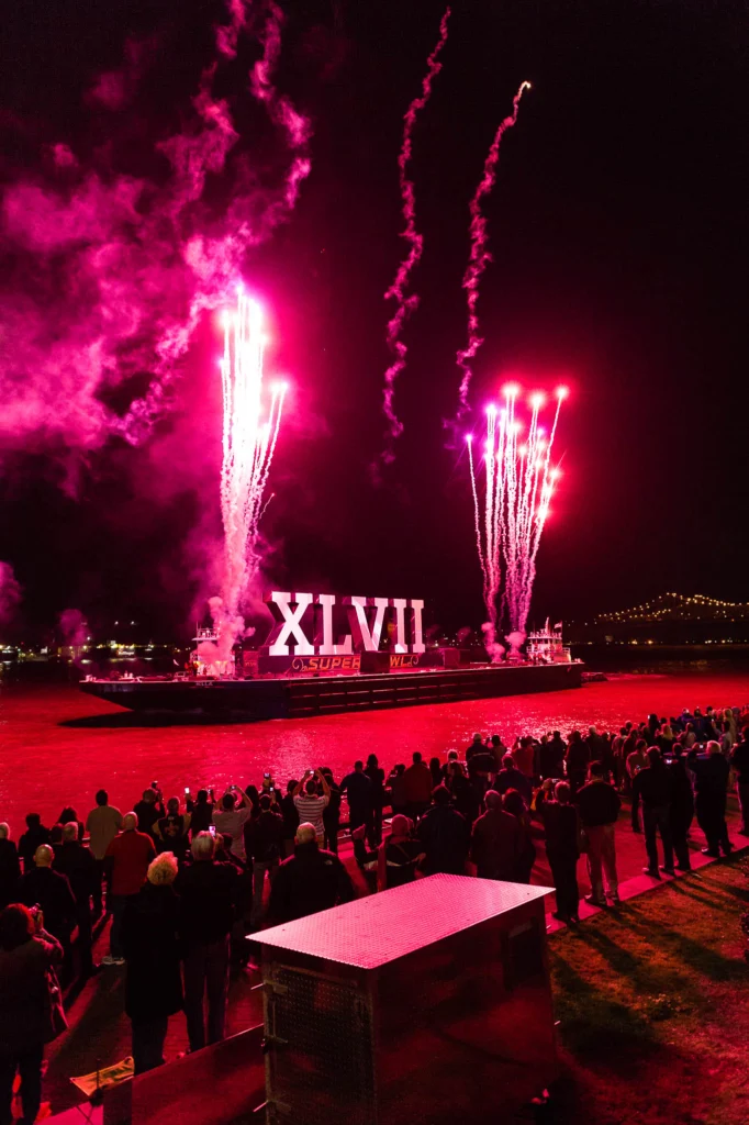 The opening fireworks display makes its way down the Mississippi River at Super Bowl XLVII in New Orleans, Louisiana.