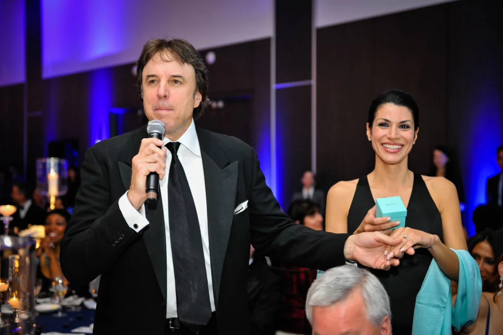 Actor and comedian Kevin Nealon telling the crowd about the Tiffany ring they should bid on at the American Cancer Society 2012 Discovery Ball.