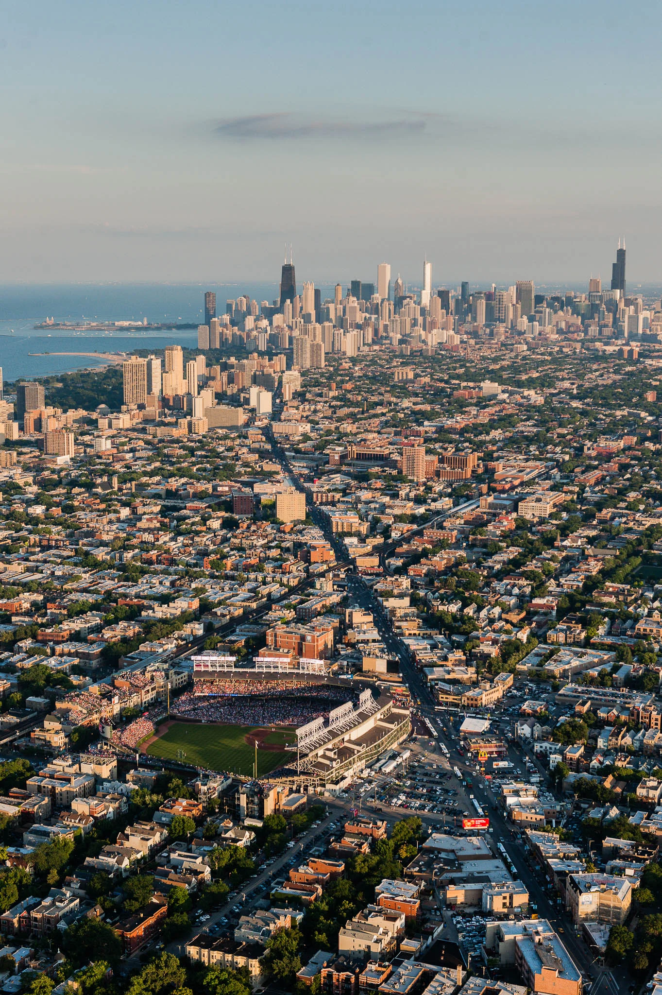 A wide angle aerial view from the northwest of Wrigley Field taken during a game against the St. Louis Cardinals. This image was taken as part of an assignment for a 100 year anniversary book on Wrigley Field for Major League Baseball.