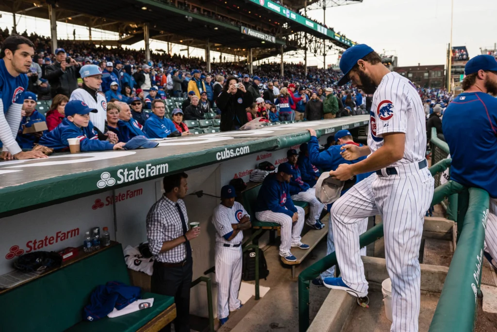 CHICAGO, IL - APRIL 5: JAKE ARRIETA #49 of the Chicago Cubs autographs a baseball cap before the Opening Night game against the St. Louis Cardinals at Wrigley Field on Sunday, April 5, 2015 in Chicago, Illinois. (Photo by Matt Kosterman/MLB Photos via Getty Images)