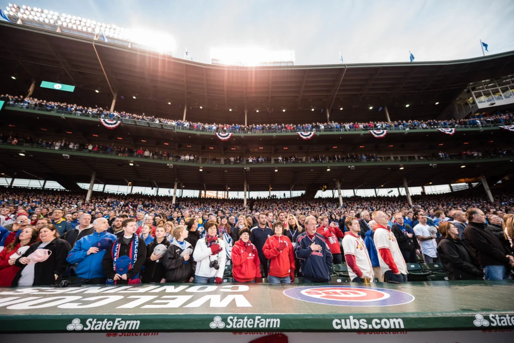 CHICAGO, IL - APRIL 5:  Fans singing the National Anthem before the start of the Opening Night game against the St. Louis Cardinals at Wrigley Field on Sunday, April 5, 2015 in Chicago, Illinois. (Photo by Matt Kosterman/MLB Photos via Getty Images)