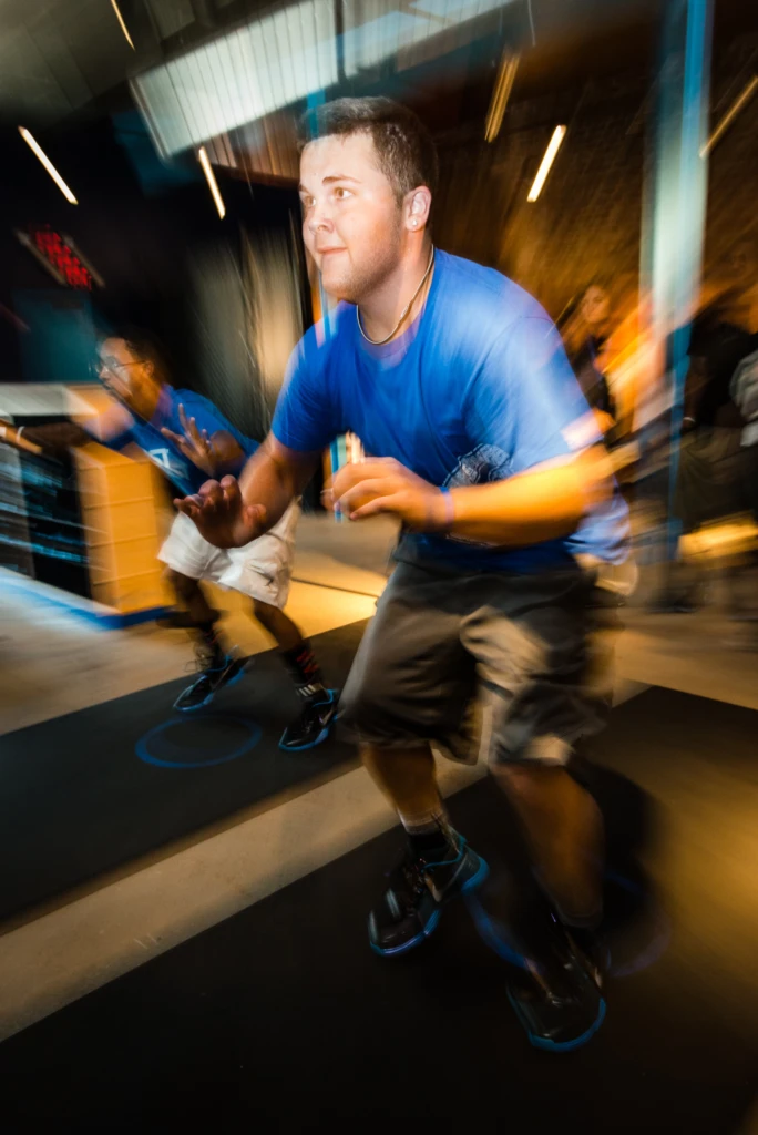 Teammates compete against each other in the "foot fires" at the Nike Fieldhouse during an event held in conjunction with the 2012 Collegiate World Series in Omaha, Nebraska.