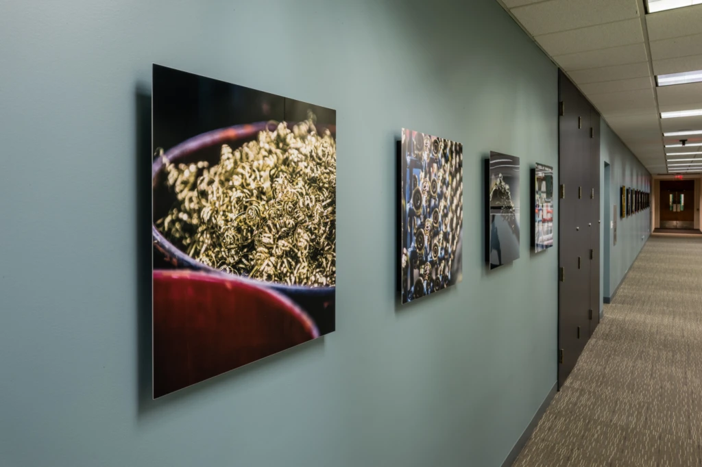 Display of custom commissioned industrial fine art photography created by Matt Kosterman for Sloan Valve Company. As displayed at their Franklin Park, Illinois headquarters.