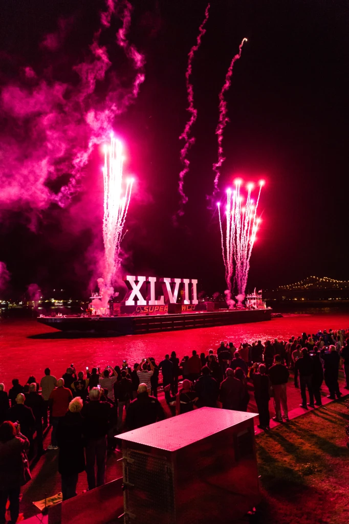 The opening fireworks display makes its way down the Mississippi River at Super Bowl XLVII in New Orleans, Louisiana.