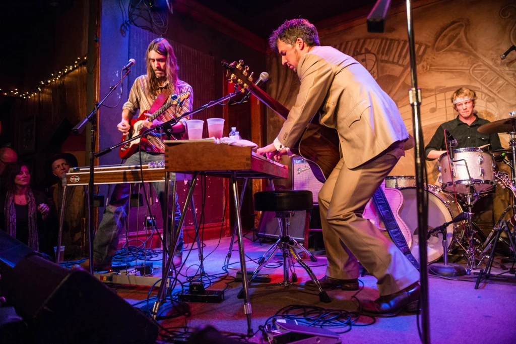 Black Lillies' front man Cruz Contreras blazes away on keyboards accompanied by guitarist Tom Pryor and drummer Bowman Townsend at Saturday's OPRF Food Pantry benefit concert at Fitzgerald's.