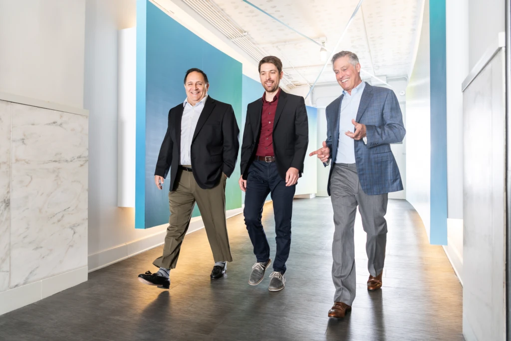 The power trio - COO, CEO and CFO - were reluctantly willing subjects for an intensive shoot at Network Perception, an infrastructure security company based in the Lyric Opera building in Chicago. A large strobe was diffused by an 8x8' silk panel outside the door to the rooftop to look like sun while another light behind and to the left of Matt lit the front of the subjects. We did five or six takes with the gentlemen walking forward a few steps at a time to keep it loose and natural. 
@mcguirephoto assist
@fulnecky assist
@danielle_dettore mua